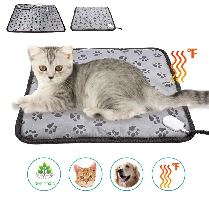 Cat lying on a heating pad with paw prints, surrounded by icons indicating non-toxicity and pet safety.