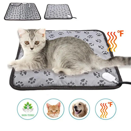Cat lying on a heating pad with paw prints, surrounded by icons indicating non-toxicity and pet safety.