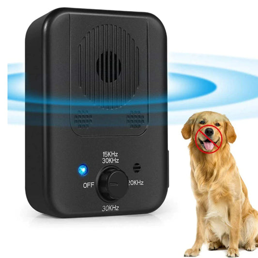 Black electronic device with frequency settings next to a dog on a white background