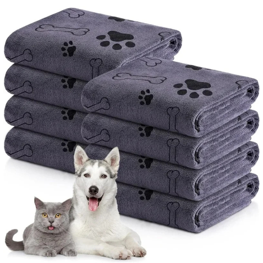 Set of gray pet towels with paw and bone patterns, featuring a dog and cat on a white background.