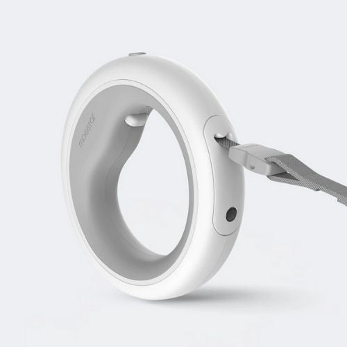 White pet collar with a strap on a light gray background