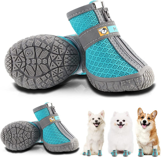 Turquoise and gray dog boots with a brand logo, displayed with three dogs for size reference.