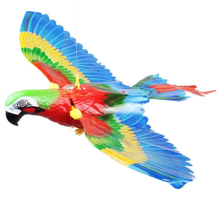 Colorful toy parrot with open wings on a white background