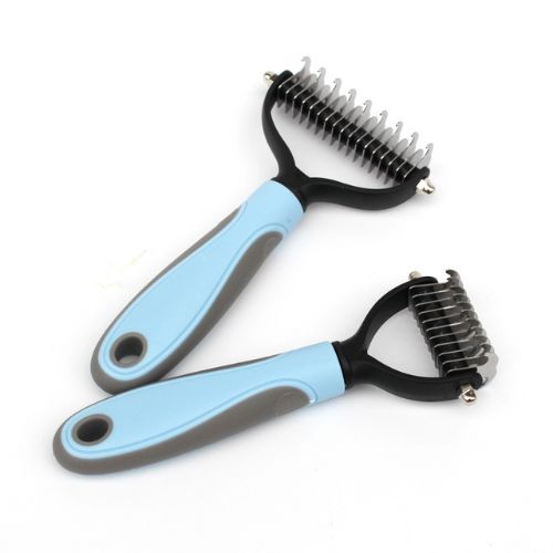 Two pet grooming tools with blue handles on a white background